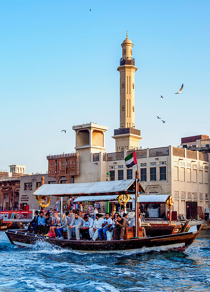 Abra Boat on Dubai Creek, Bur Dubai Grand Mosque in the background, Dubai, United Arab Emirates, Middle East