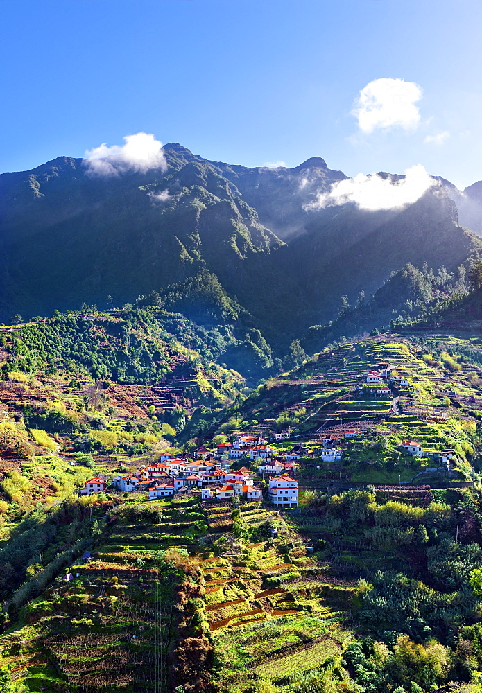 Elevated view of village and tree covered hills and mountains near Ponta Delgada, Madeira, Portugal, Atlantic, Europe