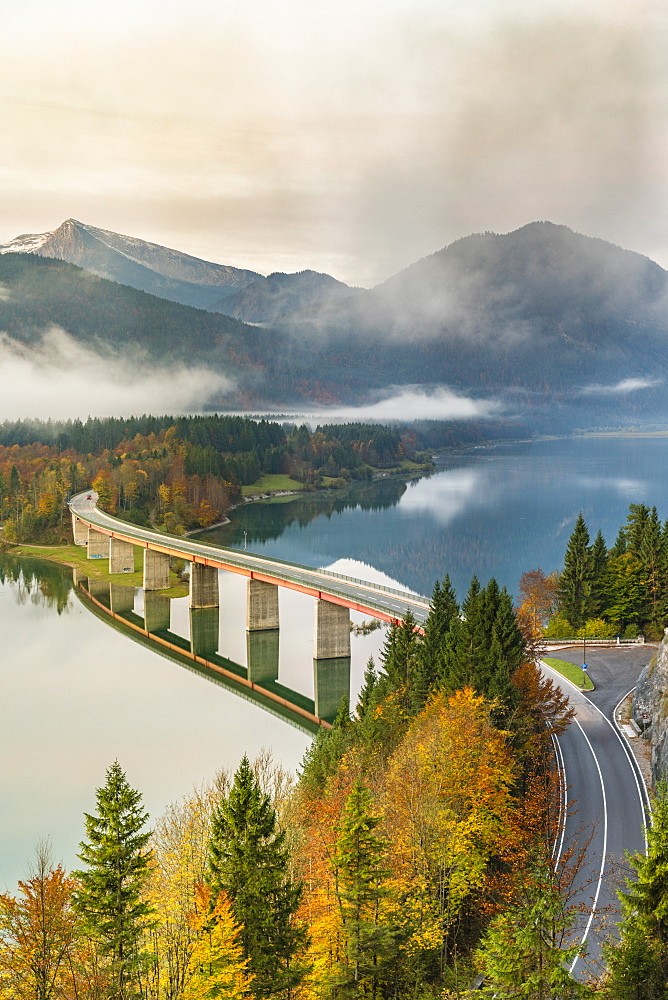 Sylvenstein Lake and bridge surrounded by the morning mist, Bad Tolz-Wolfratshausen district, Bavaria, Germany, Europe