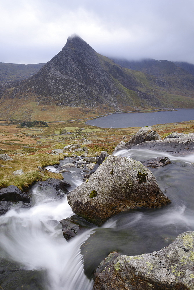 Water cascading down a fall on the Afon Lloer, overlooking the Ogwen Valley and Tryfan in the Glyderau mountain range, Snowdonia, Wales, United Kingdom, Europe