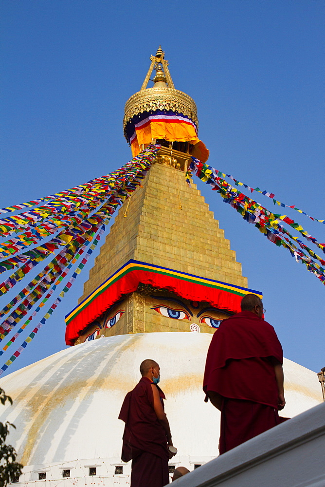 Tibetan Buddhist monks and Boudhanath Stupa, UNESCO World Heritage Site, Kathmandu, Nepal, Asia