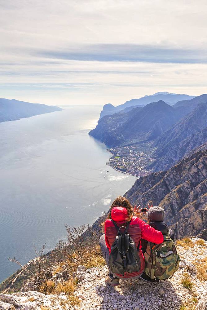 A couple take a photo at Cima Larici, Riva del Garda, Lake Garda, Trento province, Trentino-Alto Adige, Italian Lakes, Italy, Europe