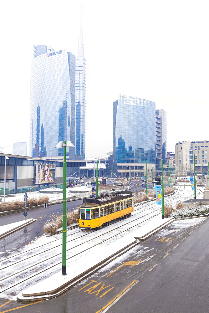 Traditional tram transit in front of skyscapers of Porta Garibaldi, Milan, Lombardy, Northern Italy, Italy, Europe