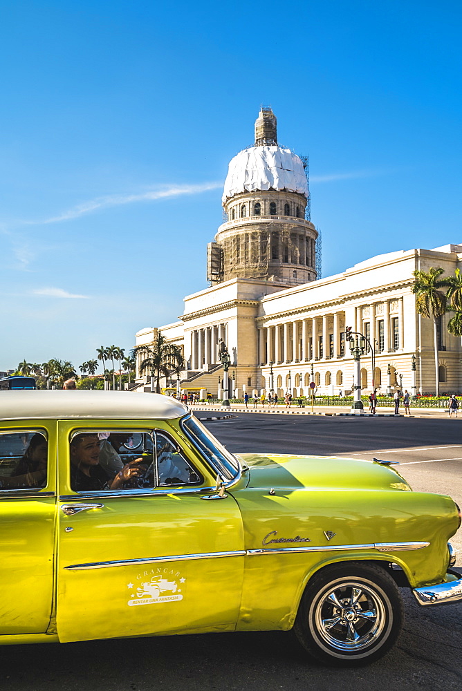 A green American car outside El Capitolio in Havana, La Habana, Cuba, West Indies, Caribbean, Central America