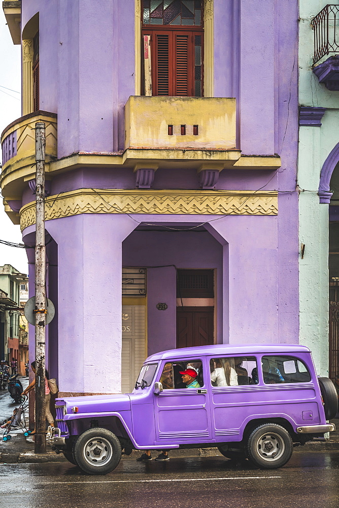 Pink building and pink vintage car in La Habana (Havana), Cuba, West Indies, Caribbean, Central America