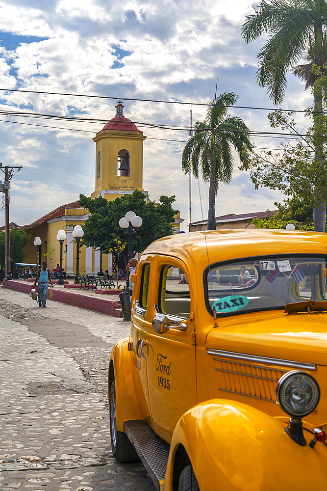 Yellow vintage taxi in Trinidad, UNESCO World Heritage Site, Trinidad, Cuba, West Indies, Caribbean, Central America