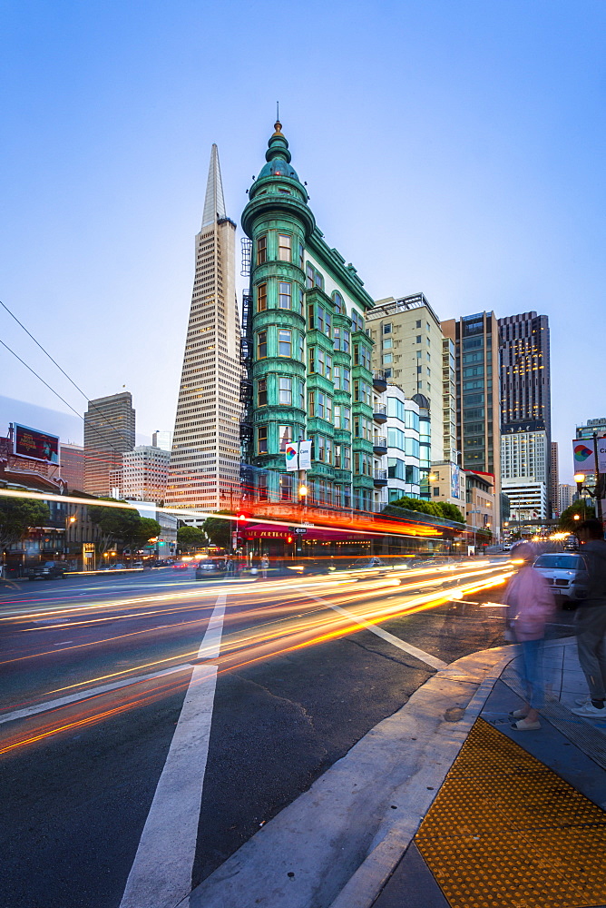 View of Transamerica Pyramid building on Columbus Avenue and car trail lights, San Francisco, California, United States of America, North America