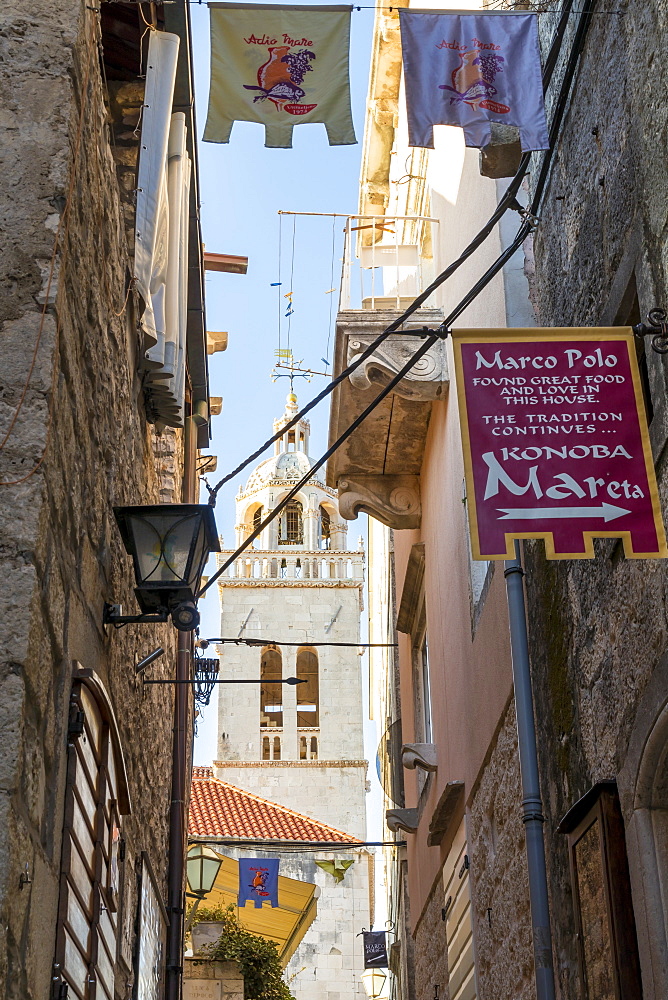 Narrow street in the old town of Korcula Town with view to the Saint Mark's cathedral, Korcula, Croatia, Europe