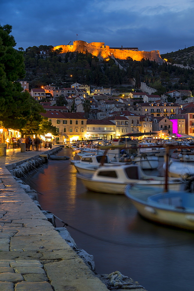 The port of Hvar Town and the Spanish Fortress at dusk, Hvar, Croatia, Europe