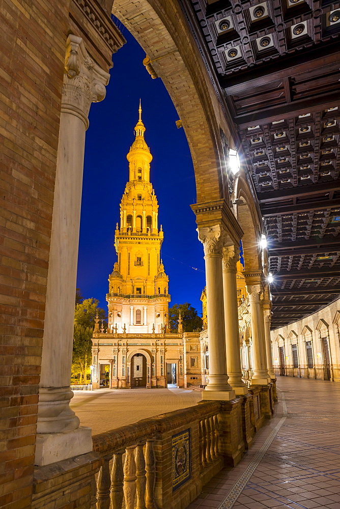 Illuminated Northern Tower at Plaza de Espana during dusk, Seville, Andalusia, Spain, Europe