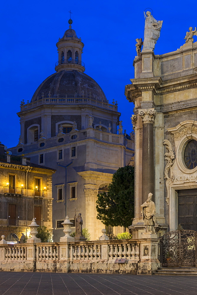 The illuminated cathedral and Saint Agatha Abbey during blue hour, Catania, Sicily, Italy, Europe