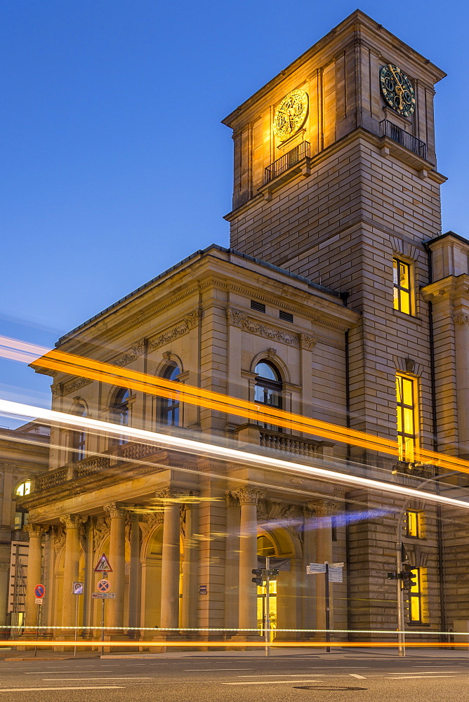 The clock tower of the Hamburg Chamber of Commerce building with traffic light trails during dusk, Hamburg, Germany, Europe