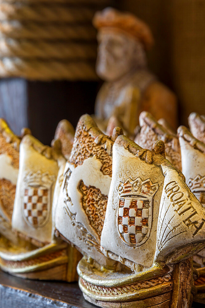 Typical souvenirs in a Marco Polo Shop in Korcula Town, the supposed birthplace of Marco Polo, Korcula, Croatia, Europe