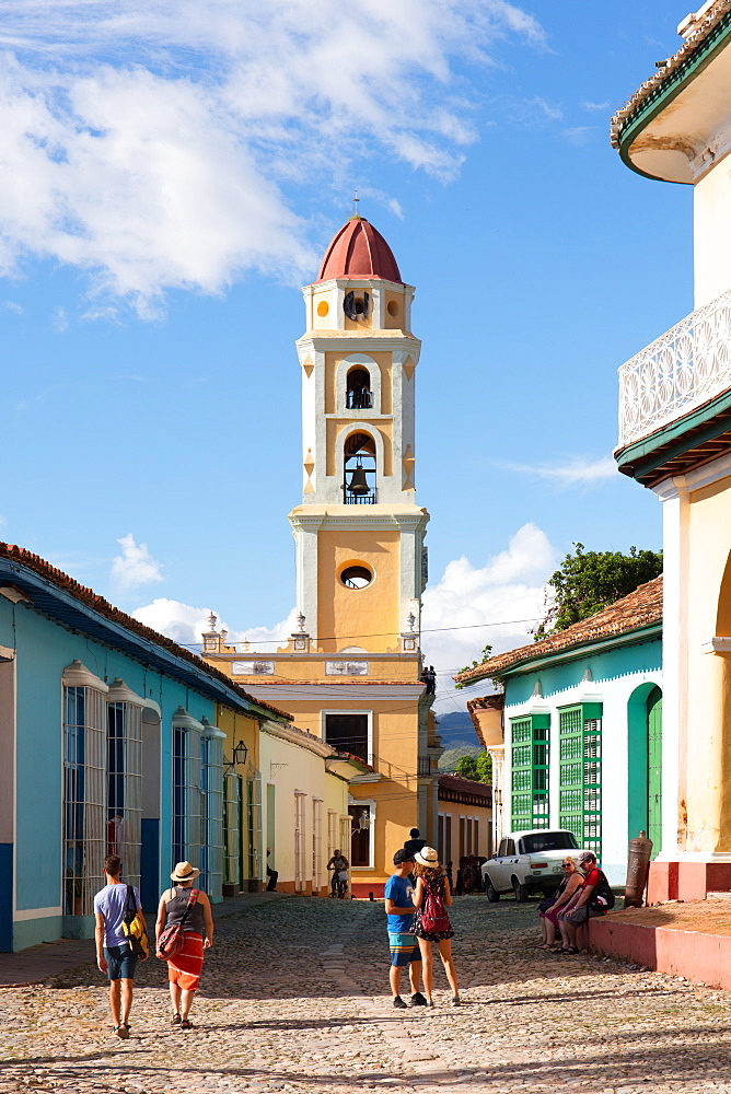 Tourists and bell tower in Trinidad, UNESCO World Heritage Site, Sancti Spiritus, Cuba, West Indies, Caribbean, Central America