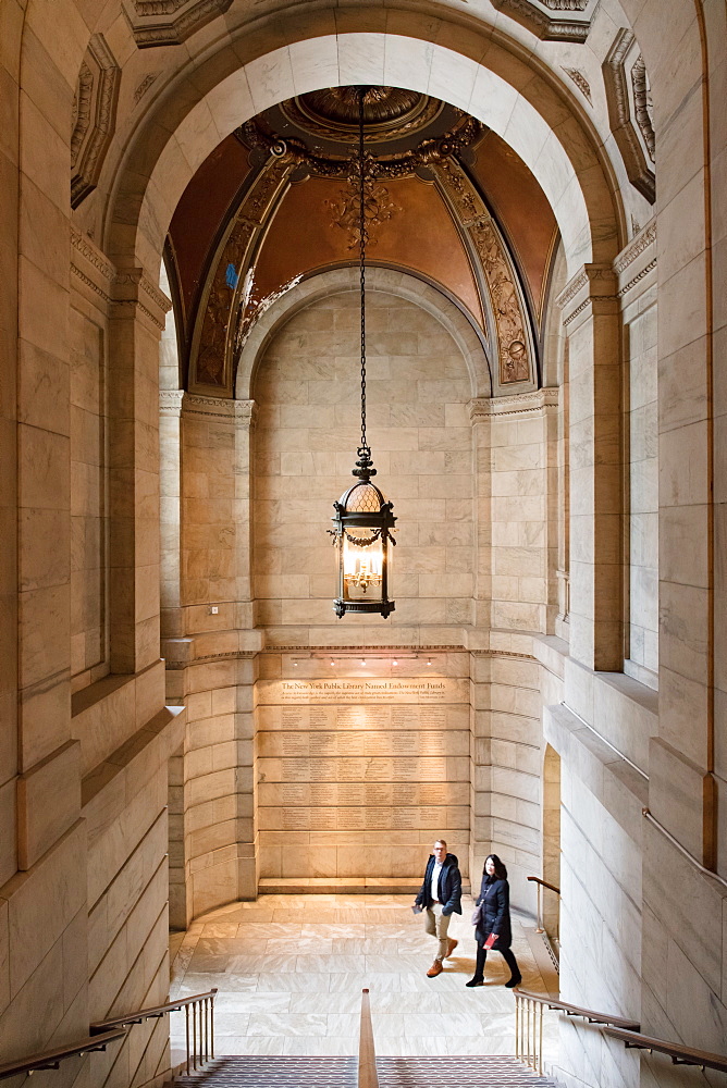 Two people walking up a staircase, New York Public Library, New York City, New York, United States of America, North America