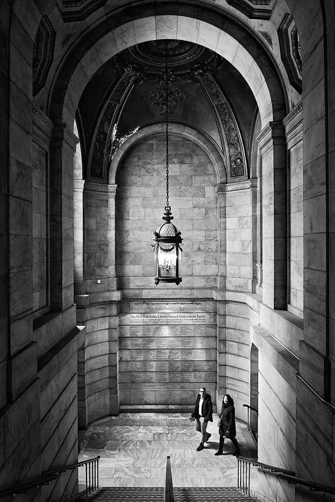 Two people walking up a staircase, New York Public Library, New York City, New York, United States of America, North America