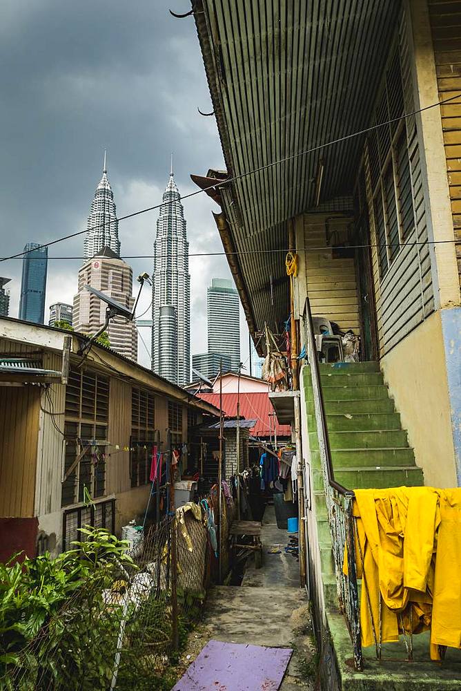 Alley in Kampung Baru with the Petronas Twin Towers in the background, Kuala Lumpur, Malaysia, Southeast Asia, Asia