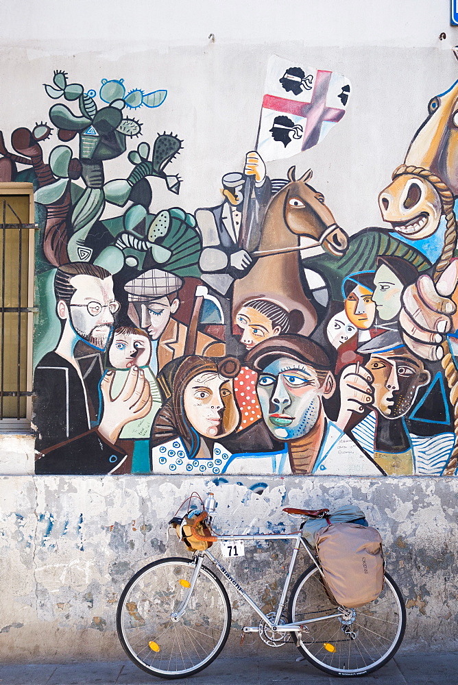 Bicycle and mural in Orgosolo, Sardinia, Italy, Europe