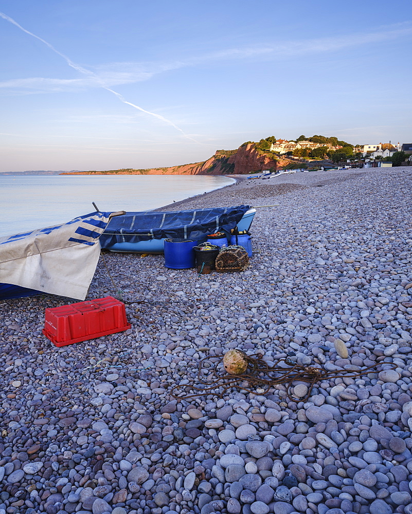 Fishing boats and gear on the pebbled beach at Budleigh Salterton, Devon, England, United Kingdom, Europe