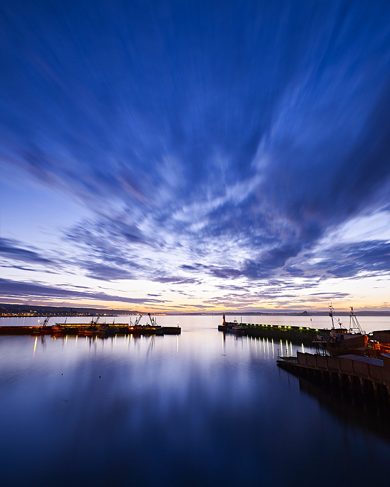 Dawn twilight across the harbour of the fishing port of Newlyn in Cornwall, England, United Kingdom, Europe