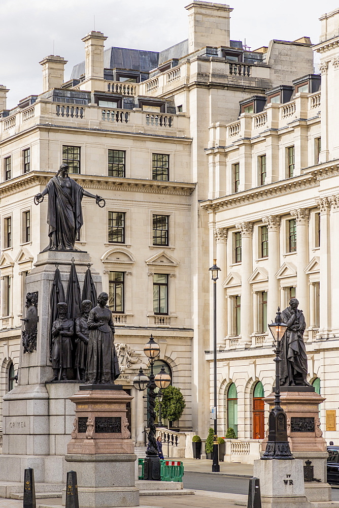 A street view, including the Crimean War Memorial, Waterloo Place, St. James, London, England, United Kingdom, Europe