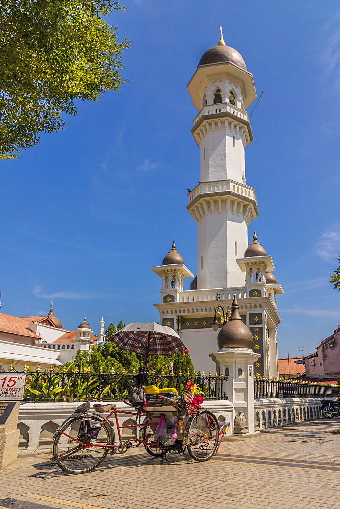 A local rickshaw (tuk tuk) outside Kapitan Keling Mosque, George Town, Penang Island, Malaysia, Southeast Asia, Asia