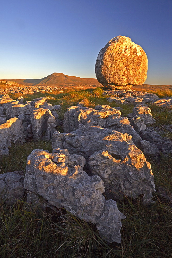 Ingleborough seen from a limestone boulder on Twistleton Scar, Yorkshire Dales National Park, North Yorkshire, England, United Kingdom, Europe