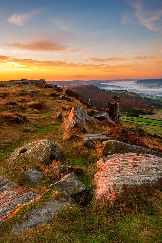 Sunrise at Curbar Edge with mist in valley, Peak District, Derbyshire, England, United Kingdom, Europe