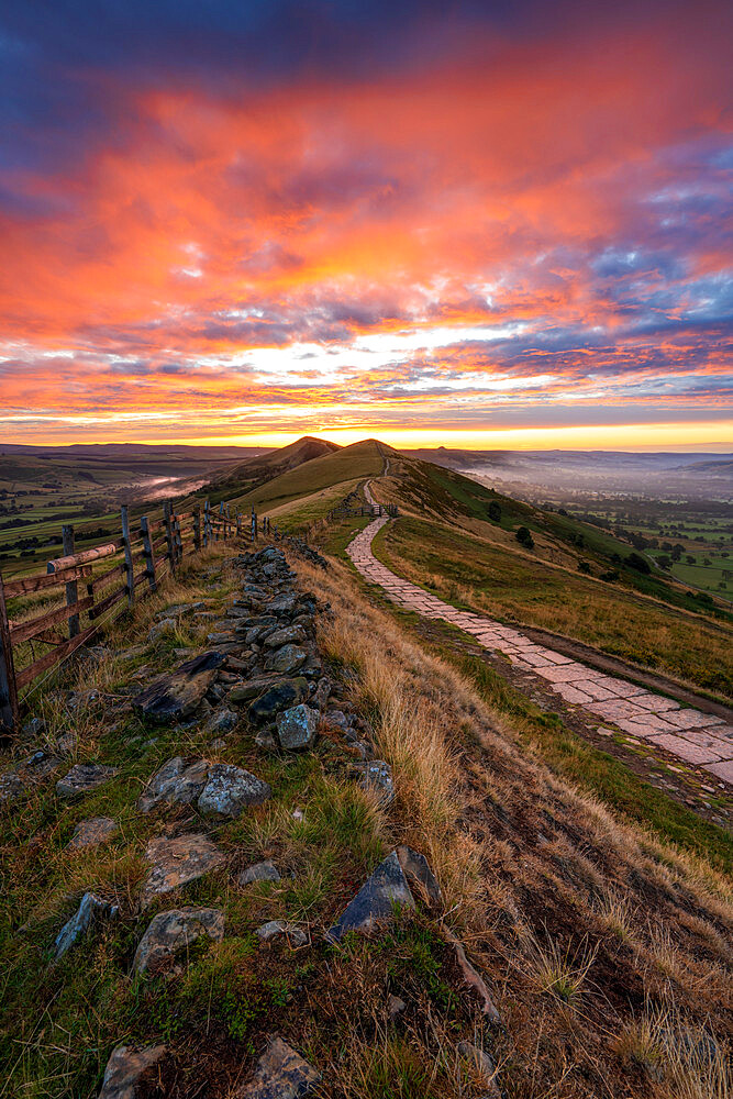 The Great Ridge and path at sunrise with fiery sky, The Peak District, Derbyshire, England, United Kingdom, Europe