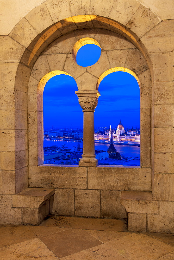 View of the Hungarian Parliament at night, from the stone window at Fisherman's Bastion, UNESCO World Heritage Site, Budapest, Hungary, Europe