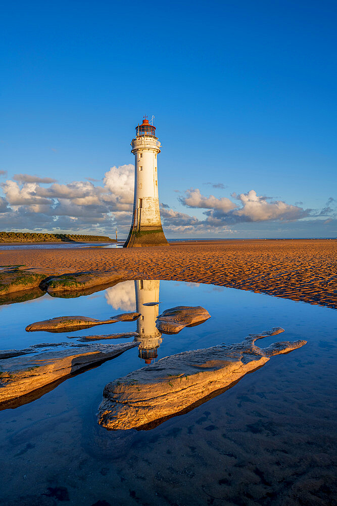 Perch Rock lighhouse with morning mirror reflections, New Brighton, Wirral, Cheshire, England, United Kingdom, Europe