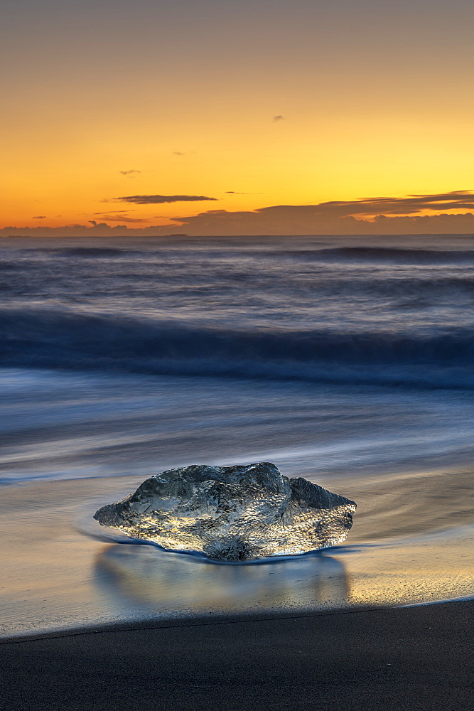 Solitary Ice formation at sunrise on ice beach at Jokulsarlon, Iceland, Polar Regions