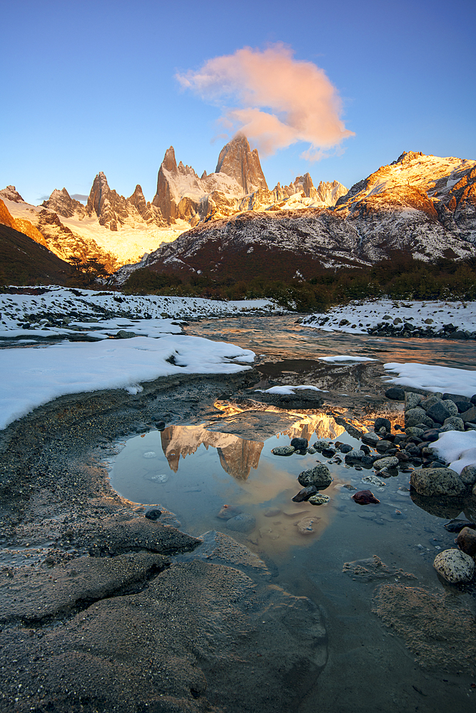 Mount Fitz Roy at sunrise reflected in flowing river, Los Glaciares National Park, UNESCO World Heritage Site, El Chalten, Santa Cruz Province, Patagonia, Argentina, South America