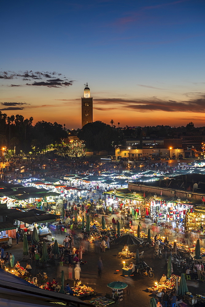 The view over the Djemaa el Fna at dusk showing food stalls and crowds of people, Marrakech, Morocco, North Africa, Africa