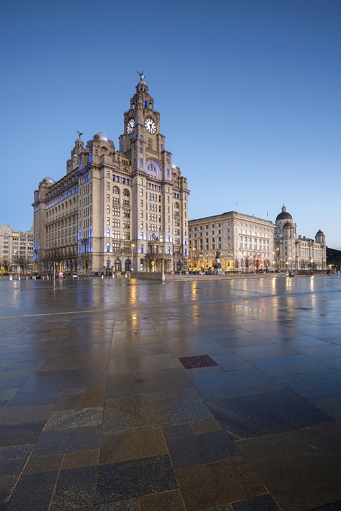 The Three Graces reflected on the Pier Head, Liverpool, Merseyside, England, United Kingdom, Europe