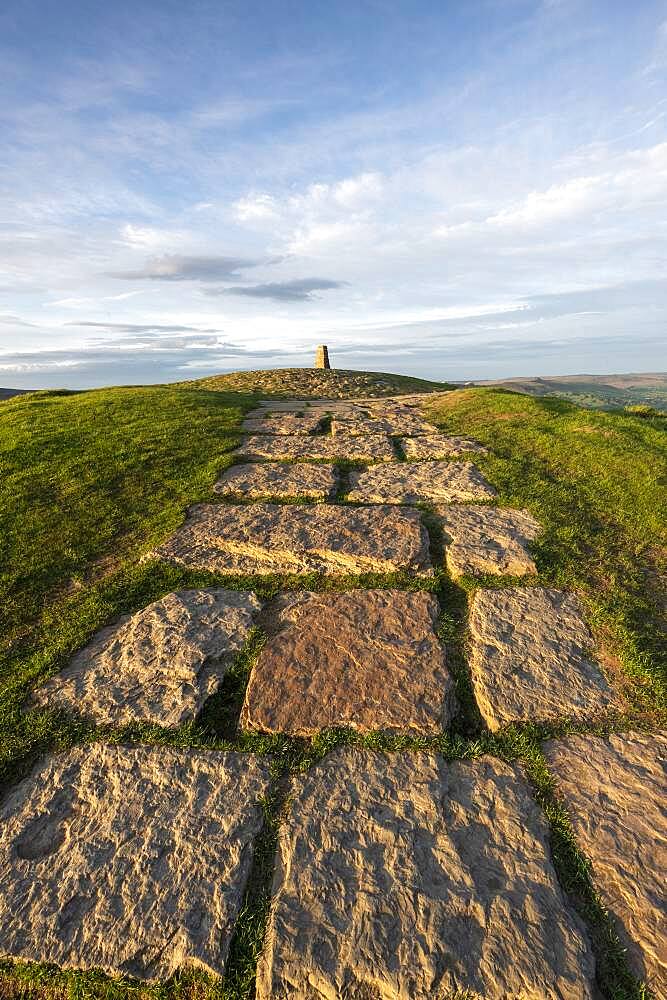 Stone path leading towards the summit and trig point at Mam Tor, High Peak, Derbyshire, England, United Kingdom, Europe