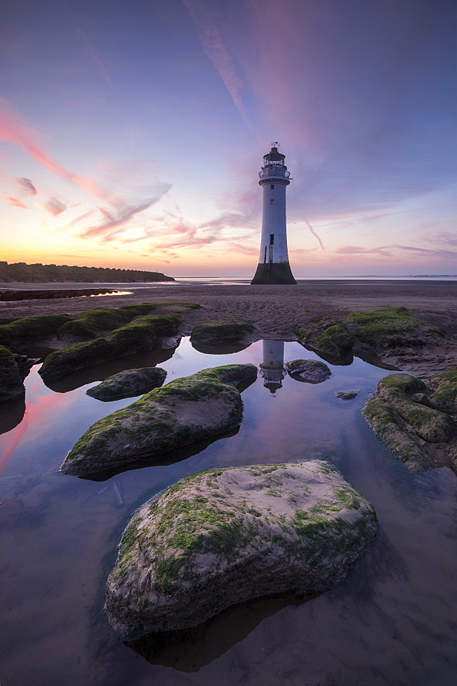 Perch Rock Lighthouse at New Brighton reflected with dramatic sunset, New Brighton, Cheshire, England, United Kingdom, Europe