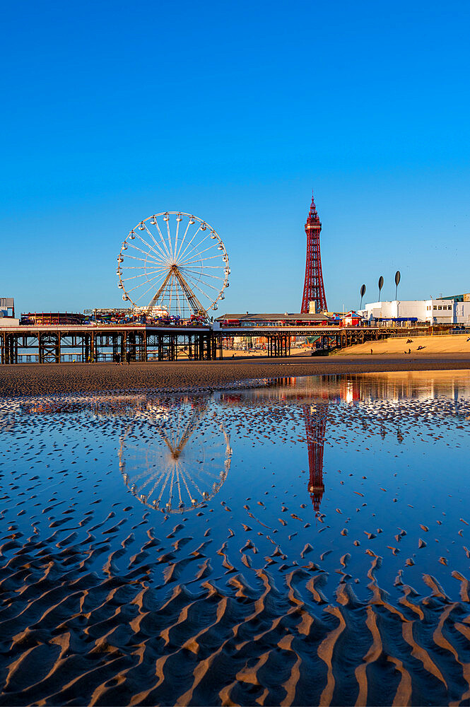 Blackpool beach with reflections of the Tower and pier, Blackpool, Lancashire, England, United Kingdom, Europe