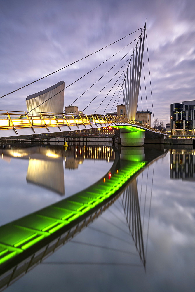 Pedestrian bridge over canal and Imperial War Museum North in Salford Quays, Manchester, England, United Kingdom, Europe