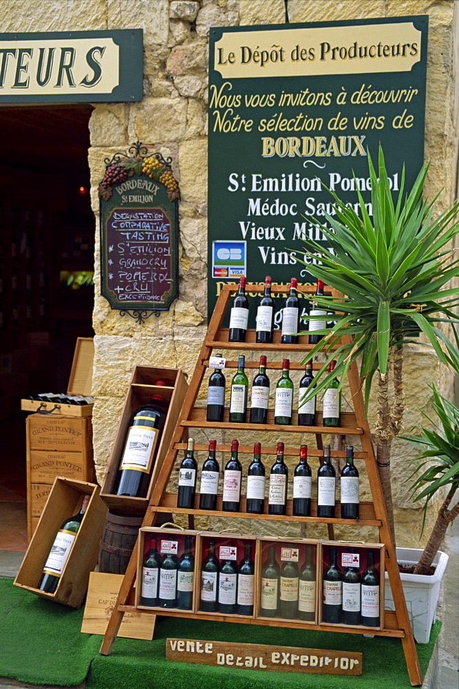 Display of wine bottles outside a shop at St. Emilion in the Gironde, Aquitaine, France, Europe