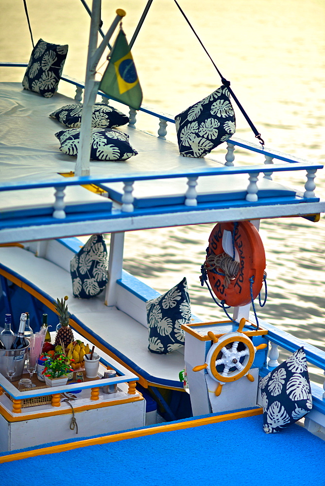 Colourful wooden boats take tourists exploring Paraty Bay, Paraty, Rio de Janeiro State, Brazil