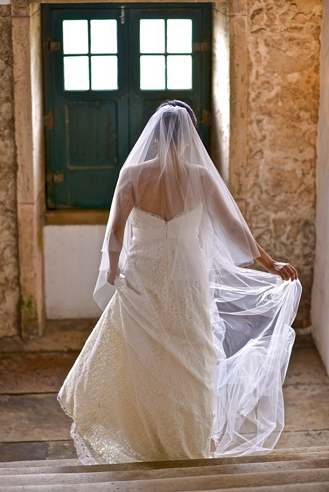 Hispanic bride getting ready on her wedding day