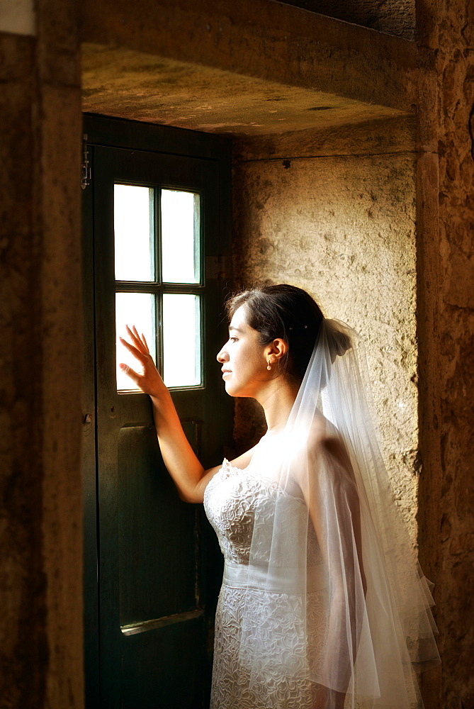 Hispanic bride getting ready on her wedding day