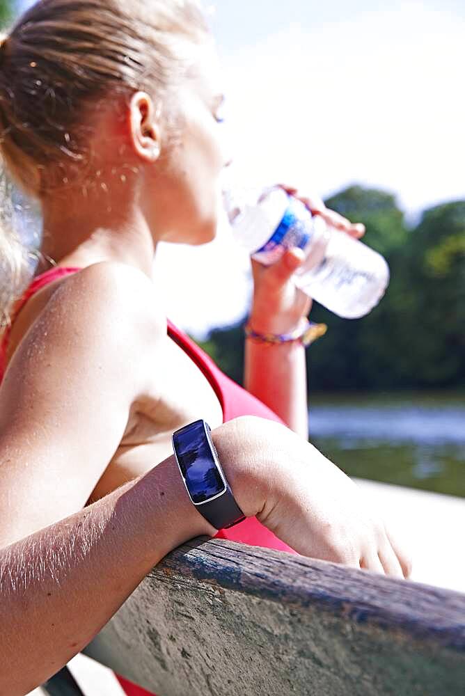 Jogger drinking water.