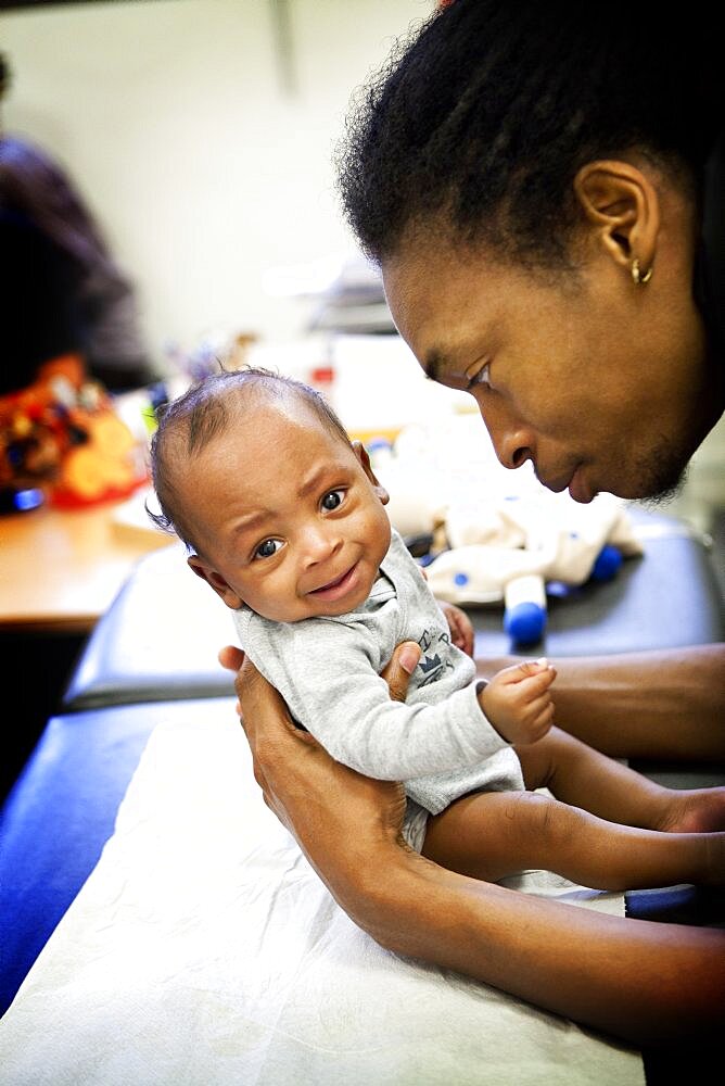 Reportage in a post-natal clinic in Champigny, France. Since leaving the neonatal unit, the twins (3-months old) are checked every week to follow their growth. Consultation with the post-natal clinic doctor.