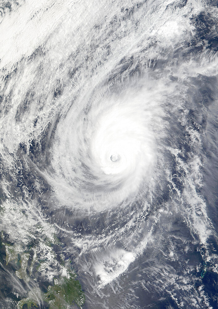 Typhoon Mitag, Philippine Sea, Asia, In 2002, True Colour Satellite Image. Typhoon Mitag on 6 March 2002 in the Philippine Sea, north of the Philippines (lower left-hand corner of the image). True-colour satellite image using MODIS data.