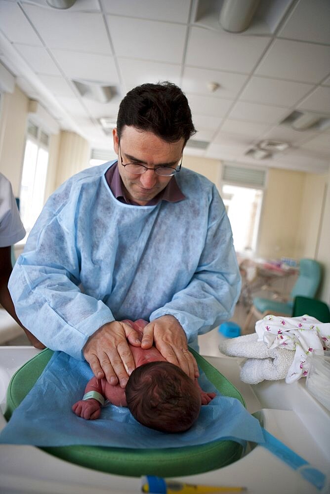 Father Massaged Newborn Baby