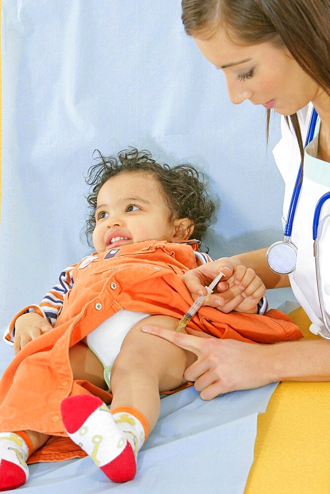 Pediatrician Vaccinating A Child