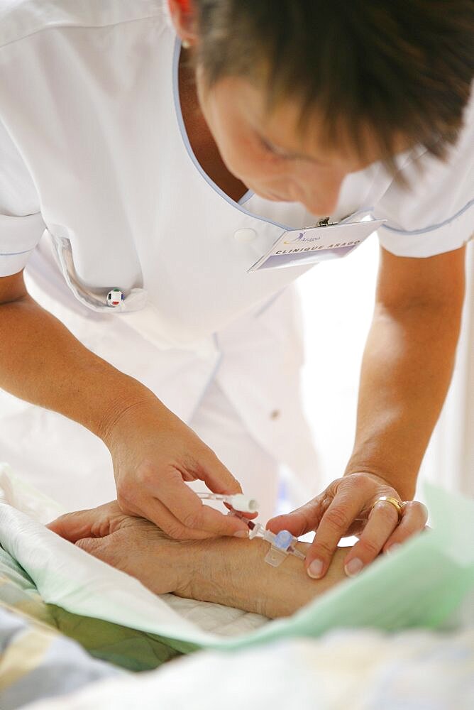 Nurse Putting in IV Drip