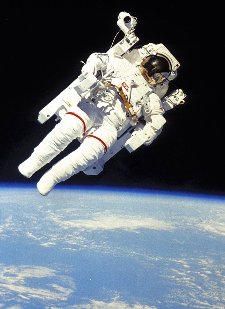 Astronaut in space suit floating in space